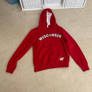 a red wisconsin zip up(womens) it feels smaller than a L so fits like a M